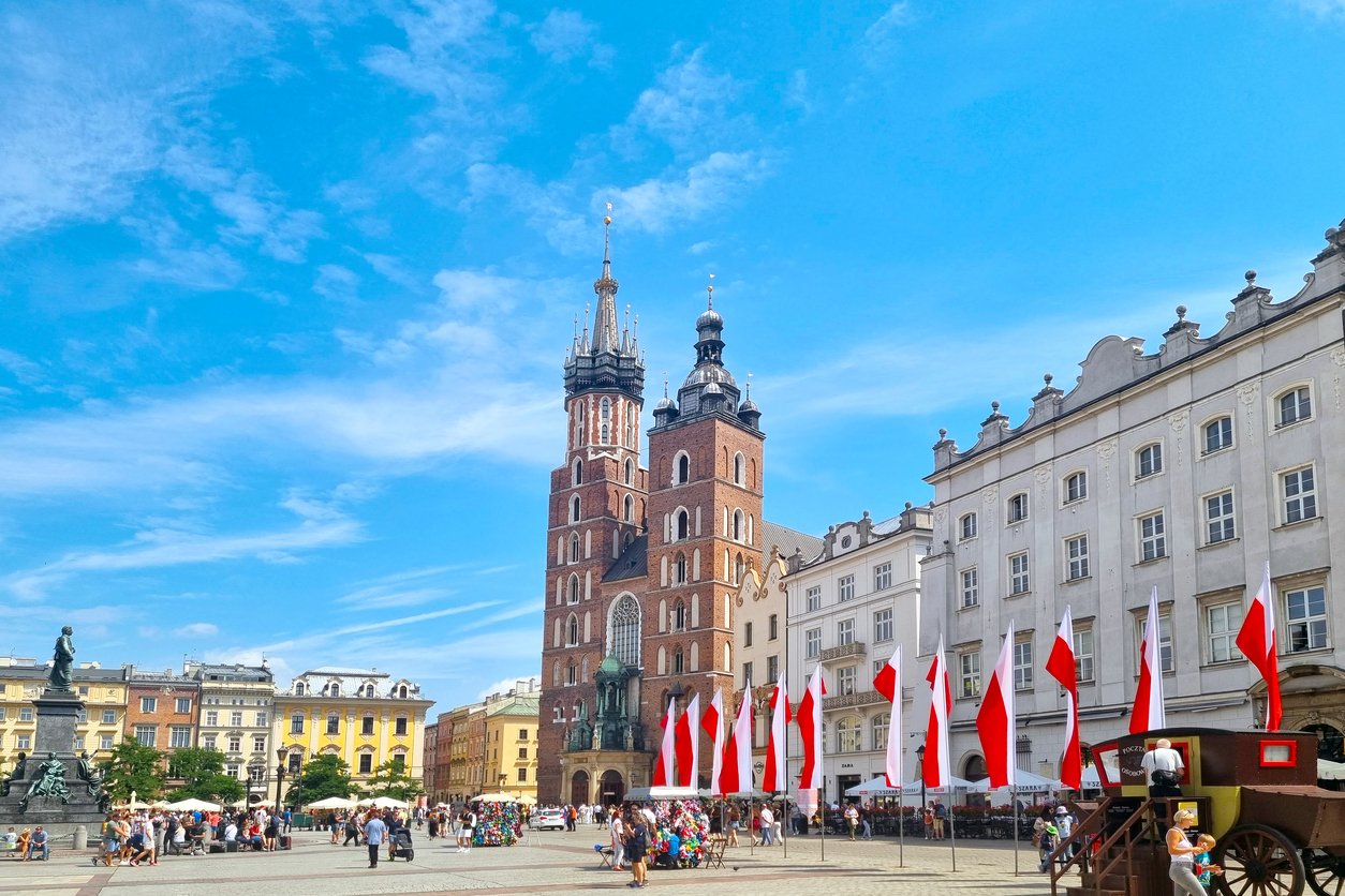 Tourists on the main city square Rynok Glowny in Krakow.