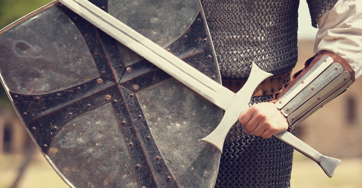 A photo of a knight in armor holding a sword and shield