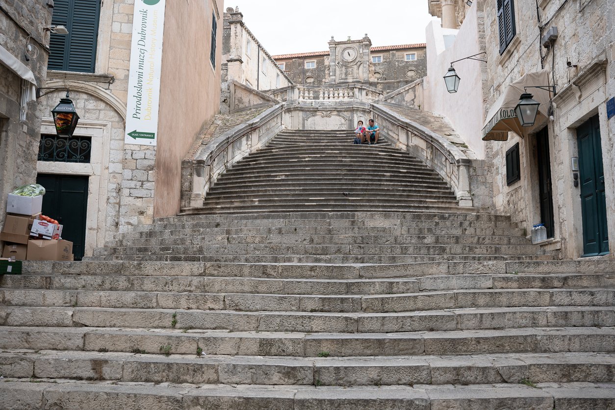 Tourists on Jesuit stone stairs in old town