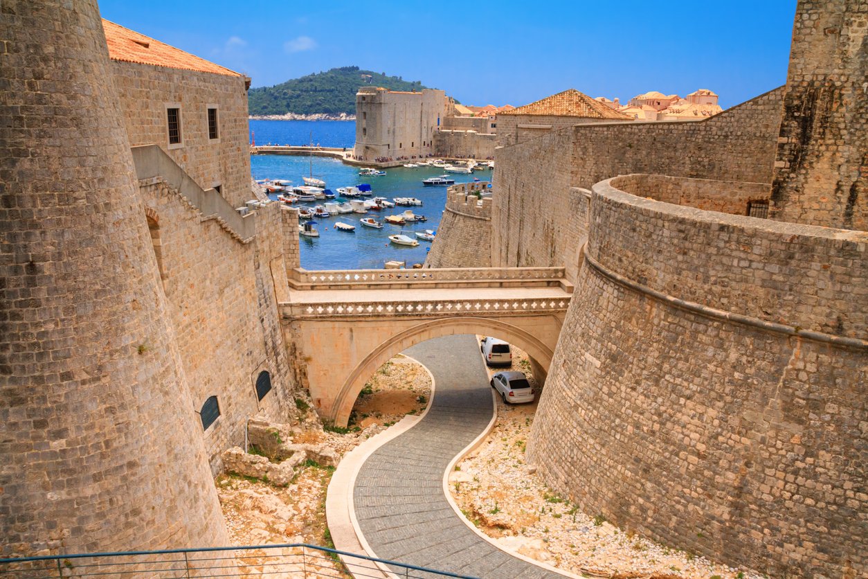 Summer cityscape view of the bridge between the Revelin Fortress and the Ploce Gate in the Old Town of Dubrovnik