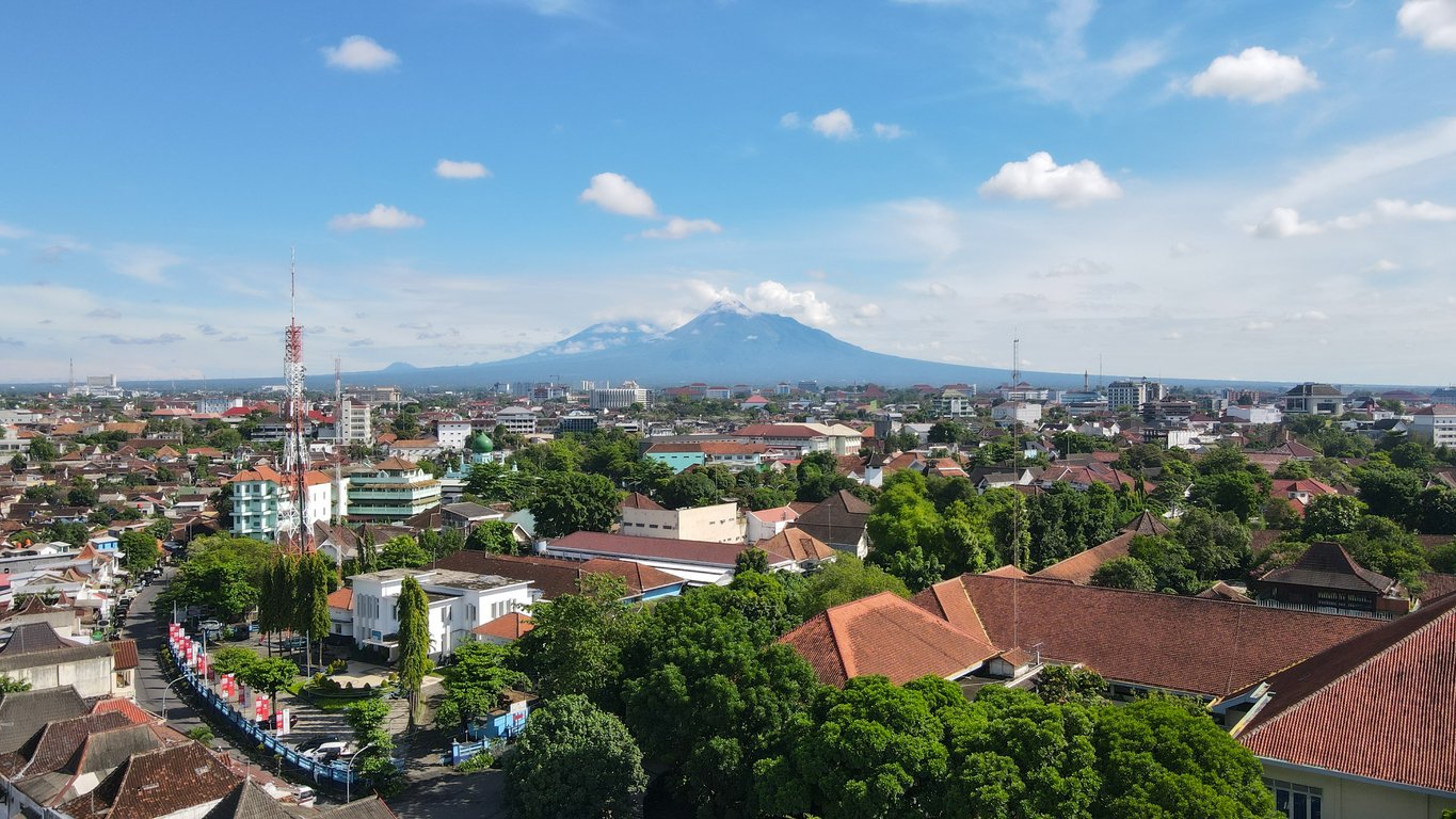 Aerial view, the morning view of the city of Yogyakarta and the magnificent Mount Merapi.