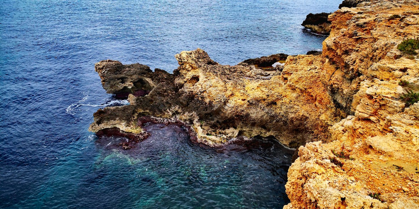 Rock shore along a hiking trail at Marfa Ridge in Malta