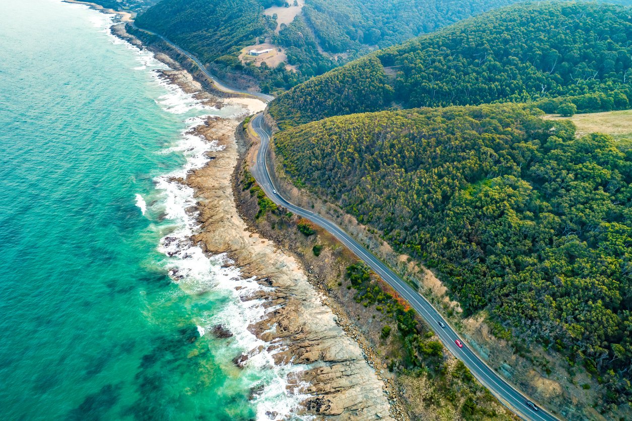 Cars driving on Great Ocean Road, Victoria, Australia aerial view