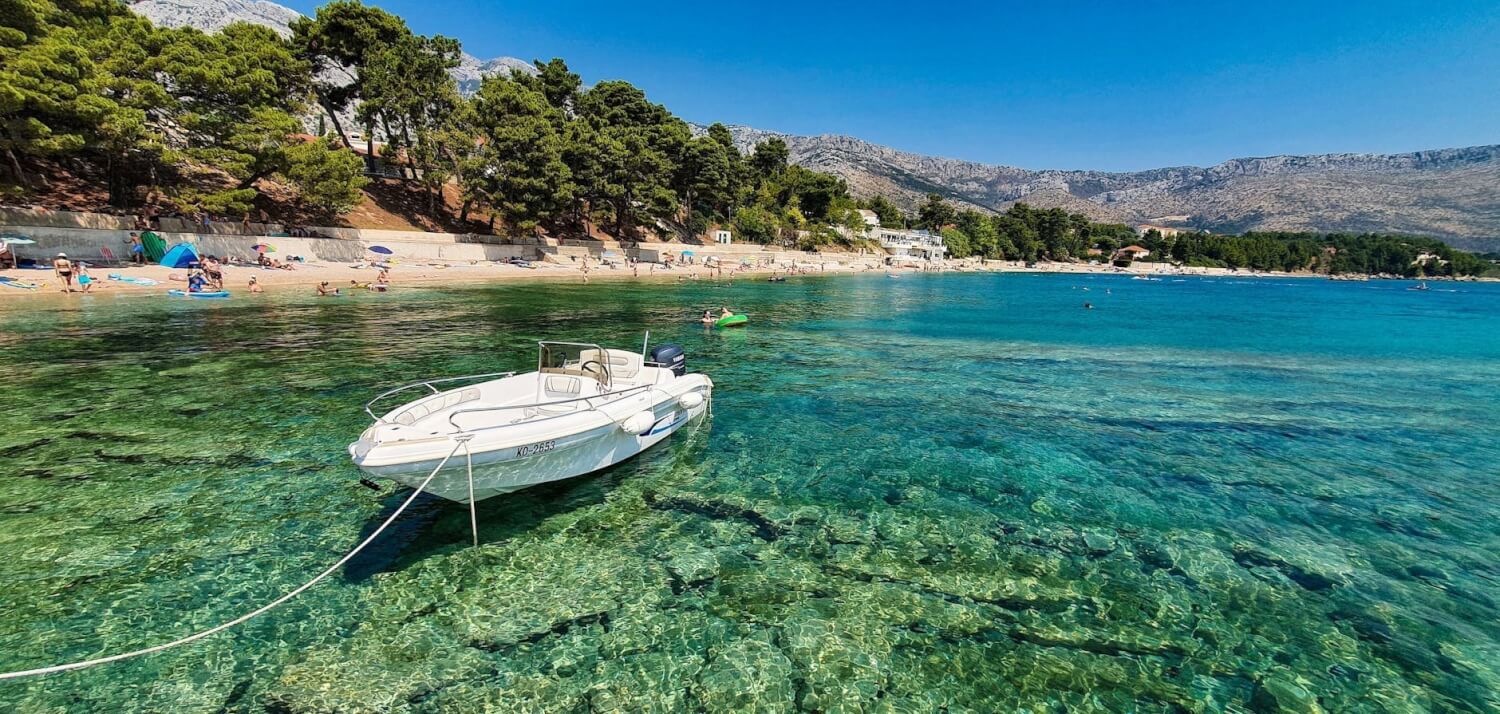 clear blue seaside with boat in croatia